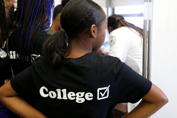 Student wearing black College t-shirt.